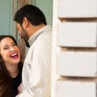 Couple laughing during their Venice Canals engagement photos.