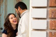 Couple laughing during their Venice Canals engagement photos.