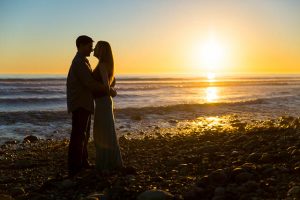 Silhouette engagement photos at the beach in Isla Vista