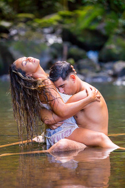 Couple passionately hugging during boudoir photoshoot in Oahu