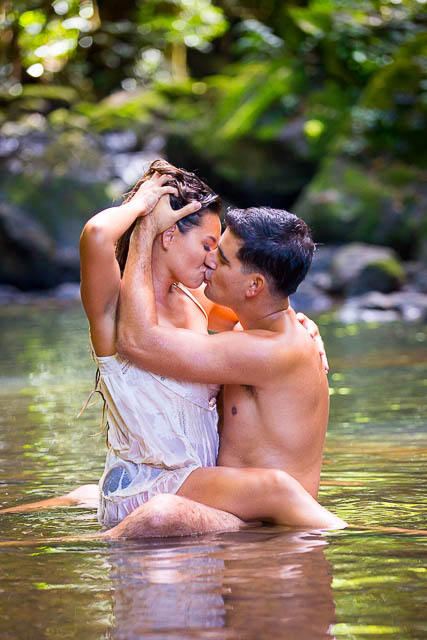 Couple passionately kissing during boudoir photoshoot in Hawaii
