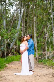 Couple kissing during their Santa Barbara maternity photoshoot.