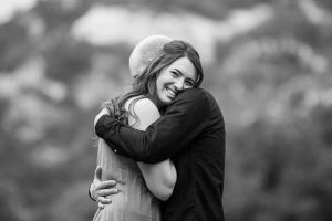 Couple hugging at Arroyo Hondo Preserve.