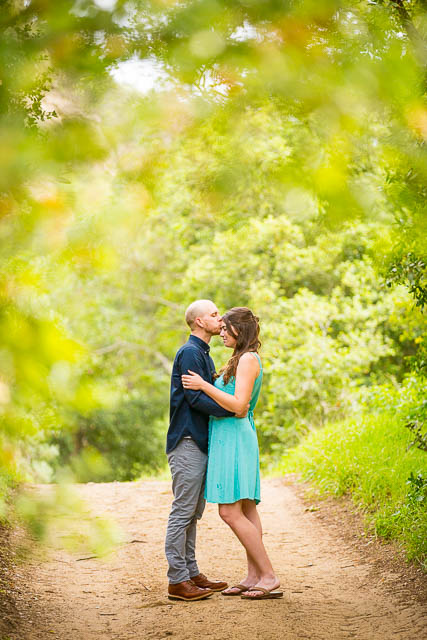 Couple kissing at Arroyo Hondo Preserve.
