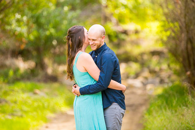 Groom laughing at Arroyo Hondo Preserve.
