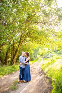 While at Arroyo Hondo Preserve in Goleta, the couple holds each other under the green trees.