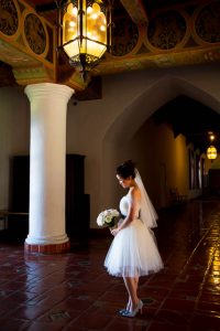 Bride poses inside the Santa Barbara Courthouse after her wedding elopement.
