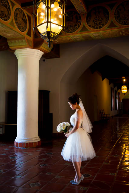 Bride poses inside the Santa Barbara Courthouse after her wedding elopement.