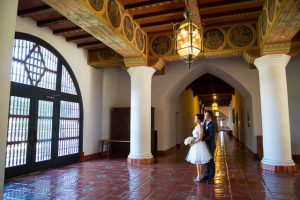 Bride and groom pose at the Santa Barbara Courthouse.