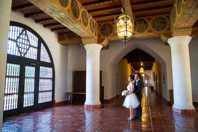 Bride and groom pose at the Santa Barbara Courthouse.