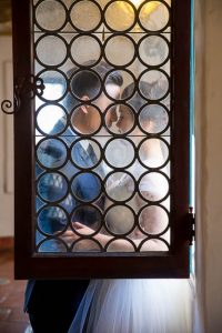 Bride and groom take photos at the Santa Barbara Courthouse.
