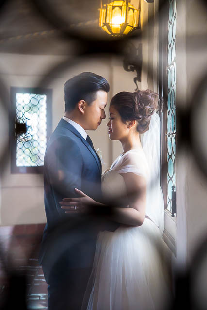 Bride and groom take photos at the Santa Barbara Courthouse.
