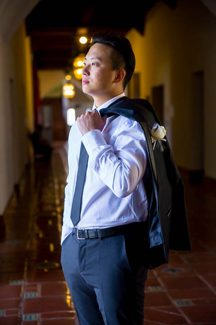 Groom poses inside the Santa Barbara Courthouse after her wedding elopement.