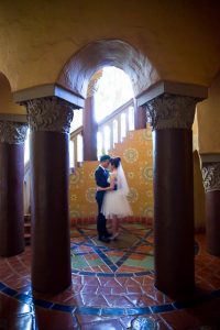 Elopement photos of the bride and groom at the Santa Barbara Courthouse.