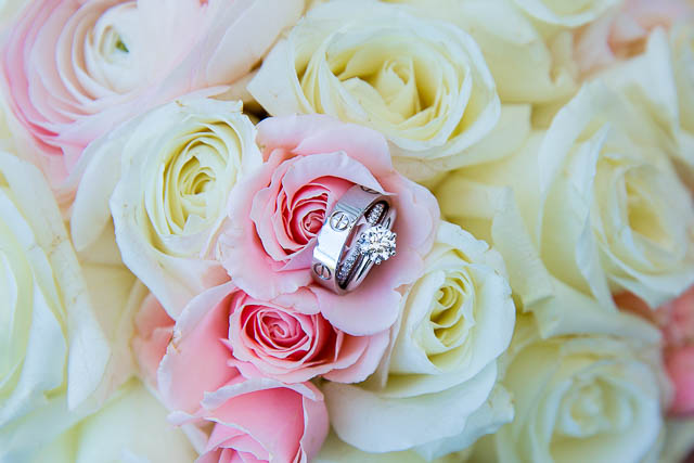 Wedding rings posed on a bouquet at the Santa Barbara Courthouse. 