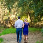 Couple embracing and laughing at their Goleta engagement photoshoot.