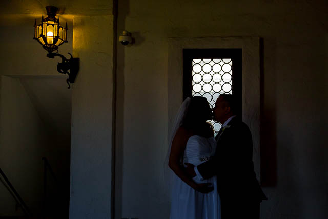Couple holding each other after getting married at the Santa Barbara Courthouse.