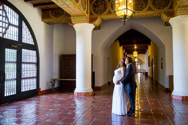 Couple holding each other after getting married at the Santa Barbara Courthouse.