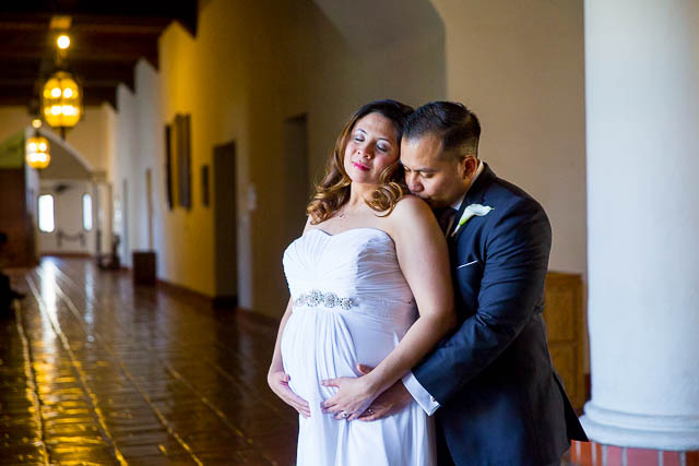 Couple holding each other after getting married at the Santa Barbara Courthouse.
