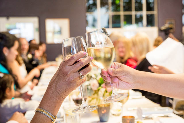 Guests toasting at the Wine Cask Wedding reception.