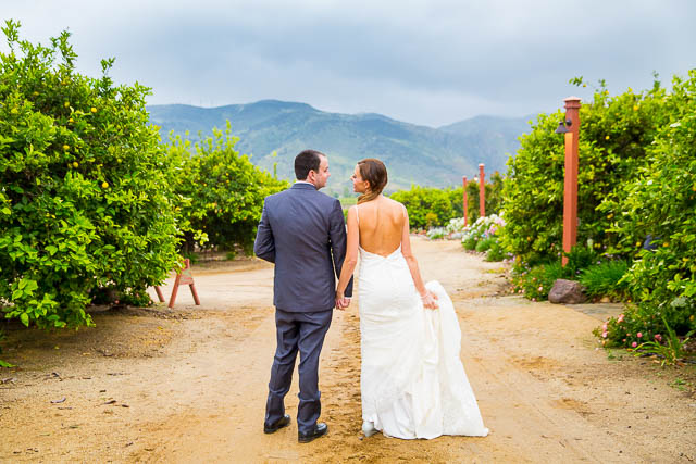 The couple posing for photos at their Gerry Ranch wedding in Camarillo.