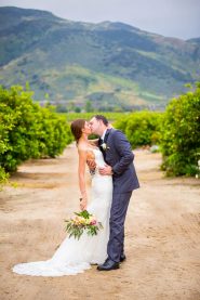 Bride and groom kissing at Gerry Ranch wedding.