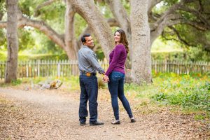 The newly engaged couple looks at each other lovingly during their Ennisbrook engagement photos.