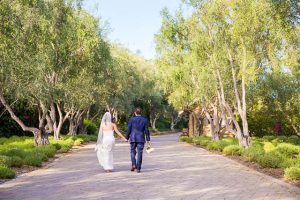 Romantic photos of the bride and groom at San Ysidro Ranch's lavender field.