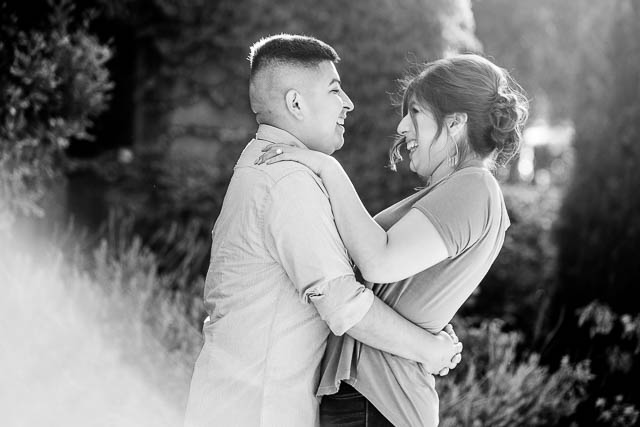 Couple hugging during their Carpinteria engagement photos.