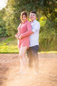 Couple holding hands during their Montecito engagement photos.