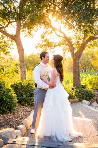 Bride and groom hugging during sunset at Elings Park wedding.