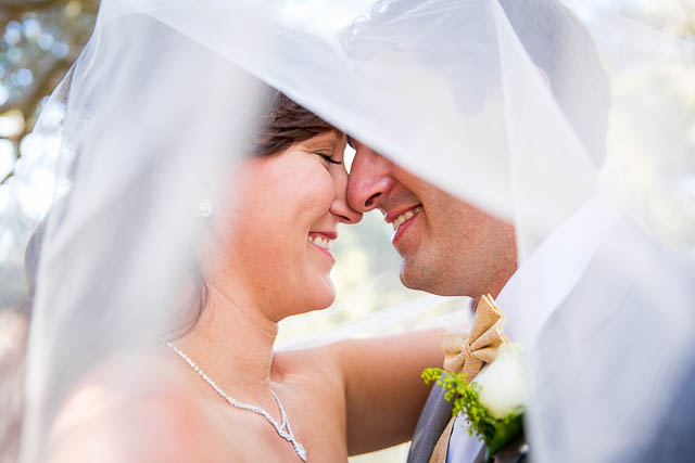 Romantic photos of the bride and groom after their Elings Park wedding.