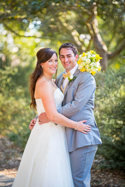 Bride and groom hugging during sunset at Elings Park wedding.