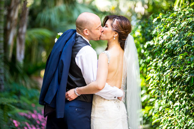 The newlyweds kissing at the Biltmore.
