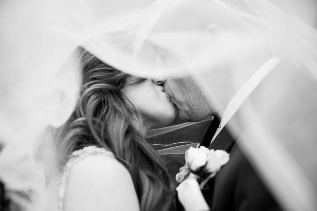 The newlyweds kissing at the Biltmore.