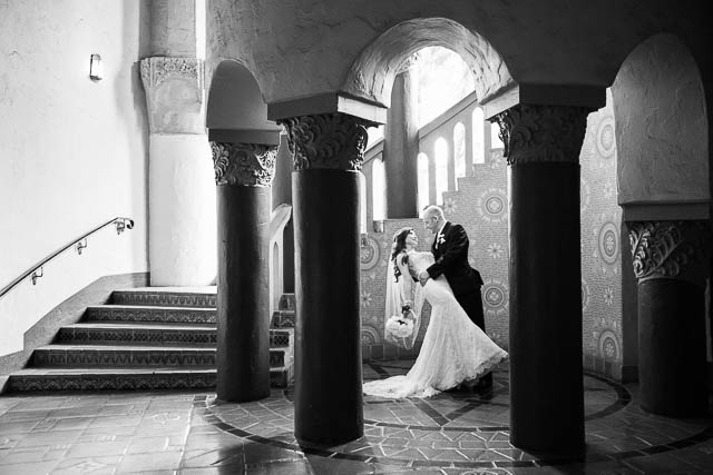 The bride and groom taking photos during their Courthouse elopement.