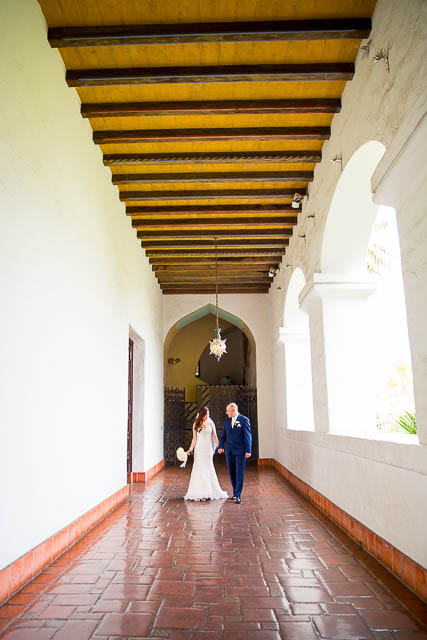 The bride and groom taking photos during their Courthouse elopement.
