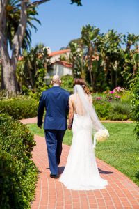 The couple taking photos at the Four Seasons Santa Barbara gardens.