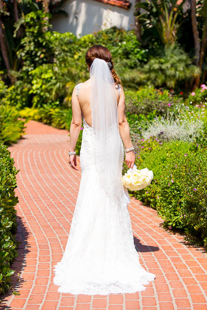 The couple taking photos at the Four Seasons Santa Barbara gardens.