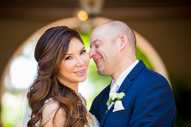 The newlyweds kissing at the Biltmore.
