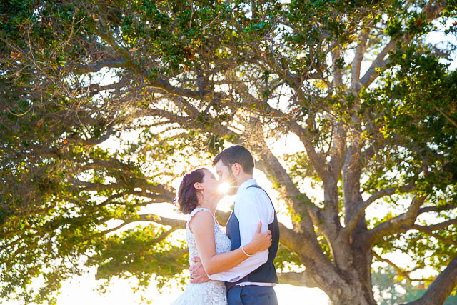 Newlyweds take sunset photos at Glen Annie Golf Club wedding.