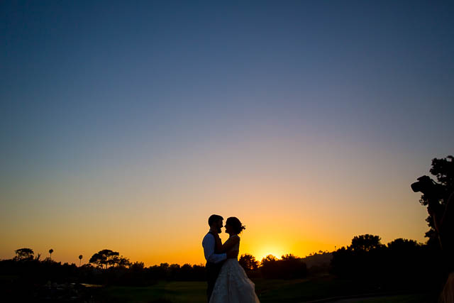 Newlyweds take sunset photos at Glen Annie Golf Club wedding.