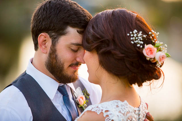 Newlyweds take sunset photos at Glen Annie Golf Club wedding.