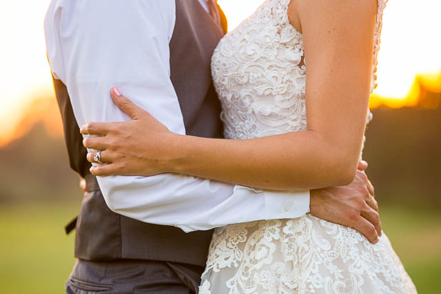 Newlyweds take sunset photos at Glen Annie Golf Club wedding.