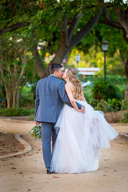 Bride and groom walking around Alice Keck Park.