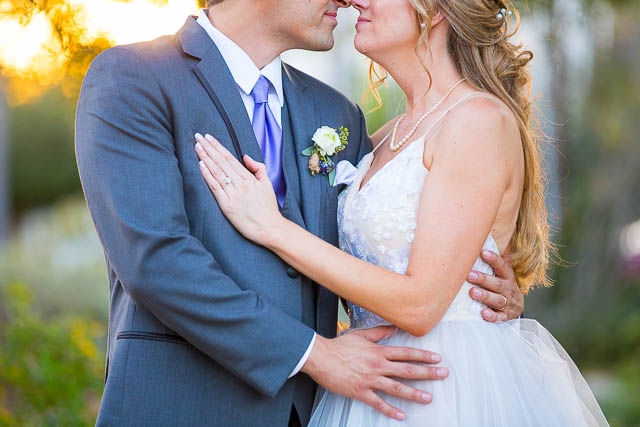 The bride and groom kissing at Alice Keck Park.
