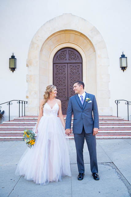 The bride and groom in front of the Unitarian Society of Santa Barbara.