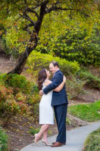 Couple kissing at the Langham Hotel Pasadena gardens.