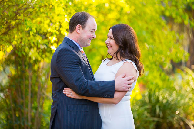 Bride and groom holding each other at the Langham Hotel Pasadena by the pond.