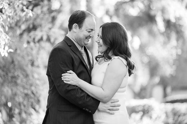 Bride and groom holding each other at the Langham Hotel Pasadena by the pond.